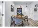 Dining room featuring round wooden table, four chairs, and a decorative bookshelf at 4221 W Spruce St # 1325, Tampa, FL 33607