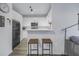 Cozy kitchen area featuring white cabinets, stainless steel appliances and breakfast bar seating at 4221 W Spruce St # 1325, Tampa, FL 33607