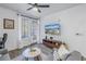 Inviting living room with a TV, modern decor, and a sliding glass door to a balcony at 4221 W Spruce St # 1325, Tampa, FL 33607
