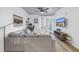 Bright living room with comfortable gray sofa and access to balcony through glass door at 4221 W Spruce St # 1325, Tampa, FL 33607