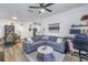 Open-concept living room with a comfortable sofa, a modern decor, and wood-style flooring at 4221 W Spruce St # 1325, Tampa, FL 33607