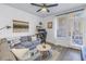 Comfortable living room with a sectional sofa, natural light, and access to the balcony at 4221 W Spruce St # 1325, Tampa, FL 33607