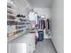 Walk-in closet features shelving and rods for ample storage at 4221 W Spruce St # 1325, Tampa, FL 33607