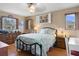Comfortable bedroom with natural light, wood floors, and ample space, creating a cozy and relaxing retreat at 4553 Kirkland Ave, Spring Hill, FL 34606