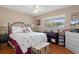 Cozy bedroom with a large window, hardwood floors, and neutral paint at 4553 Kirkland Ave, Spring Hill, FL 34606