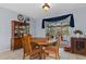 Comfortable dining area with wooden furniture and a view of the screened in patio and pool at 4553 Kirkland Ave, Spring Hill, FL 34606