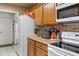 Functional kitchen featuring updated appliances, ample cabinet space, and a brick backsplash at 4553 Kirkland Ave, Spring Hill, FL 34606