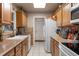 A functional galley kitchen with ample counter space and well-lit with modern appliances at 4553 Kirkland Ave, Spring Hill, FL 34606