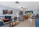 Spacious living room with comfortable seating, tile floors, and natural light, creating an inviting atmosphere at 4553 Kirkland Ave, Spring Hill, FL 34606