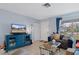 Cozy living room with a comfortable sofa, stylish furnishings, and a bright window, creating an inviting space at 4553 Kirkland Ave, Spring Hill, FL 34606