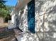 Backyard exterior featuring a newly painted home, water access, and AC system at 4604 Courtland St, Tampa, FL 33610
