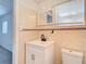 Bathroom showcasing tile walls, new fixtures, and sink at 4604 Courtland St, Tampa, FL 33610