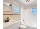Bathroom features tile walls, new fixtures, and plenty of natural light at 4604 Courtland St, Tampa, FL 33610