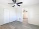 Bedroom features wood-look floors, ceiling fan, and closet at 4604 Courtland St, Tampa, FL 33610