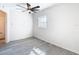 Bedroom showcasing gray floors, natural light, and neutral walls at 4604 Courtland St, Tampa, FL 33610