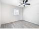Bedroom showcasing gray floors, natural light and neutral wall color at 4604 Courtland St, Tampa, FL 33610