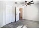 Bedroom showcasing a ceiling fan, gray flooring, and a closet at 4604 Courtland St, Tampa, FL 33610