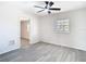Bright bedroom features a modern ceiling fan, and light gray flooring at 4604 Courtland St, Tampa, FL 33610