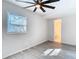 Bedroom featuring wood-look floors, neutral walls, and window at 4604 Courtland St, Tampa, FL 33610