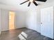 Bedroom featuring gray flooring, closet, and access to a bathroom at 4604 Courtland St, Tampa, FL 33610