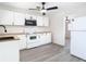 Kitchen featuring white cabinets and modern microwave providing an efficient and visually appealing cooking area at 4604 Courtland St, Tampa, FL 33610