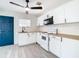 Bright kitchen featuring white cabinets, and modern appliances offering a functional and stylish culinary space at 4604 Courtland St, Tampa, FL 33610