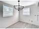 Bright laundry room with two windows for natural light, making chores feel less of a burden at 4604 Courtland St, Tampa, FL 33610