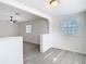 Bright and airy living room features light grey wood-look flooring, neutral walls and great natural light at 4604 Courtland St, Tampa, FL 33610
