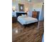 Comfortable bedroom featuring hardwood floors, a bed, and classic wood furniture at 4915 Bay Ne St # 322, St Petersburg, FL 33703