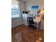 Bedroom featuring hardwood floors, a desk, and a bright window view at 4915 Bay Ne St # 322, St Petersburg, FL 33703
