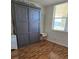 Bedroom featuring hardwood floors, a built in wardrobe, and a bright window view at 4915 Bay Ne St # 322, St Petersburg, FL 33703
