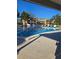 Inviting community swimming pool with plenty of lounge chairs and nearby building at 4915 Bay Ne St # 322, St Petersburg, FL 33703