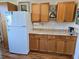 Kitchen cabinets and counter with modern appliances and wood flooring at 4915 Bay Ne St # 322, St Petersburg, FL 33703