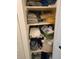 Well-organized linen closet with an array of shelves and storage for towels and linens at 4915 Bay Ne St # 322, St Petersburg, FL 33703
