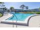 Community pool and lounge area at condo building in the sunshine at 4915 Bay Ne St # 322, St Petersburg, FL 33703