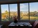 View from the sunroom showing greenery and other buildings through multiple windows at 4915 Bay Ne St # 322, St Petersburg, FL 33703