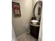 Small bathroom with a bowl sink on a wood cabinet and neutral-colored tiles at 4915 Pond Ridge Dr, Riverview, FL 33578