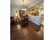 Inviting dining room featuring wood floors, a chandelier, and an open layout to the kitchen at 4915 Pond Ridge Dr, Riverview, FL 33578
