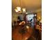 Elegant living room with chandelier, hardwood floors, and comfortable seating area at 4915 Pond Ridge Dr, Riverview, FL 33578