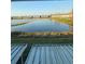 This community features a waterfront view with green space and apartment buildings surrounding it at 4915 Pond Ridge Dr, Riverview, FL 33578