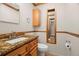 Updated bathroom featuring granite countertops, framed mirror and tiled flooring at 4926 Camellia S Way, St Petersburg, FL 33705