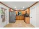 Updated kitchen featuring stainless steel appliances, granite countertops and tiled backsplash at 4926 Camellia S Way, St Petersburg, FL 33705