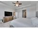 Comfortable main bedroom with a ceiling fan and a view into the home's living spaces at 5125 Tannin Ln, Bradenton, FL 34211