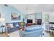 Relaxing living room with a calming blue color palette, soft lighting, and a view of the outdoor scenery at 526 5Th N Ave, Safety Harbor, FL 34695