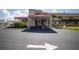 Clubhouse entrance featuring well-maintained landscaping and clear directional signage at 5840 30Th S Ave # 208, Gulfport, FL 33707
