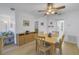 Cozy dining area with a wooden table, seating for four, and view into living room and kitchen at 5840 30Th S Ave # 208, Gulfport, FL 33707