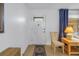 Bright entryway featuring a white front door, a side table with lamp, and neutral decor at 5840 30Th S Ave # 208, Gulfport, FL 33707
