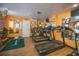 Community exercise room featuring modern treadmills and workout equipment with mirrored wall at 5840 30Th S Ave # 208, Gulfport, FL 33707