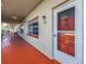 Exterior hallway with unit number 208, leading to the front door of a condo unit at 5840 30Th S Ave # 208, Gulfport, FL 33707