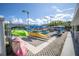 Exterior kayak storage area with an assortment of colorful kayaks and outdoor lighting at 5840 30Th S Ave # 208, Gulfport, FL 33707